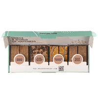 8 brownies in 4 verschillende smaken in een Brownie Box op een witte achtergrond.