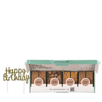 Doosje gevuld met brownies en een happy birthday topper 