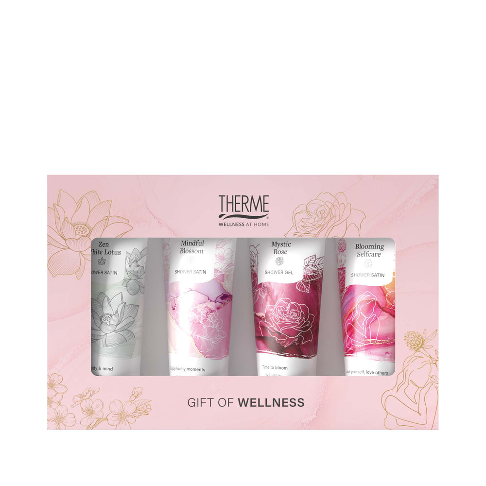 Roze Therme Gift of Wellness geschenkverpakking met vier doucheproducten in de varianten Zen White Lotus, Mindful Blossom, Mystic Rose en Blooming Selfcare.